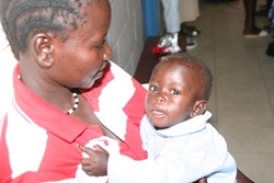 A mother and baby wait for treatment at the Martha Clinic, Yei. This photo ws taken during a Connor visit in January 2010.