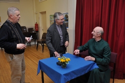 Canon Mayne signs copies of his new book at the launch event in St John's Parish, Malone.