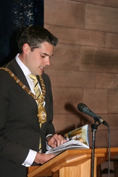 Lord Mayor Gavin Robinson reads an extract from the new guidebook at the launch in St Anne's.