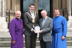 At the launch of the Cathedral guidebook are, from left: Bishop Alan Abernethy. Lord Mayor of Belfast Alderman Gavin Robinson, guidebook author Norman Weatherall and Dean John Mann.