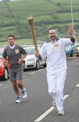 Andrew during his torch run in Carnlough.