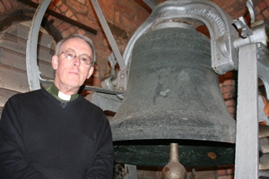 The Rev Ron Elsdon, rector of St Bartholomew's, Stranmillis, with the ancient bell which will be sounded during the Queen's Jubilee visit to Northern Ireland.