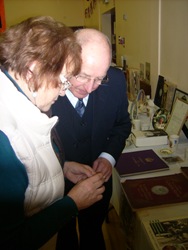 Ronnie Talbot and Larraine Leacocke take a close look at one of the items in the display of Royal memorabilia at Drummaul Parish.