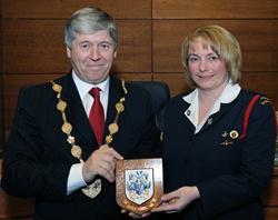 Lisburn Mayor, Councillor Brian Heading, pictured presenting a plaque to Alison Stevenson (Captain) to mark the 50th anniversary of the formation of St Paul's Girls' Brigade Company.