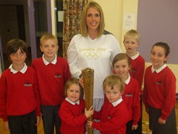Paralympian Dianne McMillan shows some of the Cairncastle PS pupils her Olympic torch.