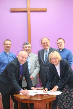 Covenant signing, back, from left: Rev John Alderdice, Methodist Chaplain at Queen's; Prof Alan Hibbert, Chair, Church of Ireland Executive Committee; Rev Donald Ker, Methodist chair of the Chaplaincy Committee; Rev Barry Forde, Church of Ireland Chaplain at Queen's. Front, L-R The Rt Rev Alan Abernethy, Bishop of Connor and Rev Heather Morris, Methodist District Superintendent.