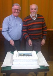 The Rev Sam Jones (previous rector) and the current rector of St Saviour's, Connor, the Rev Ian Magowan, cutting the 200th anniversary cake.