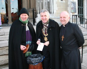 Lord Mayor of Belfast Máirtín Ó Muilleoir launches the Black Santa sitout along with the Dean of Belfast and the Bishop of Connor, The Rt Rev Alan Abernethy.