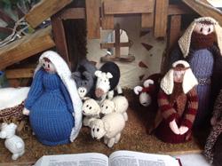 A knitted nativity scene complements the knitted tree.