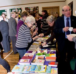 Rosemary Patterson, Bishop's Secretary, looks after sales at the Good Book Shop stall.