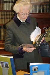 Heather Kingan, whose father Cuthbert Peacocke was Dean of Belfast in the 1960s, peruses the displays at the new Cathedral library.