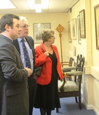 Cathedral curate the Rev Andrew Campbell shows original designs of St Anne's to former Dean Houston McKevley and his wife Roberta.