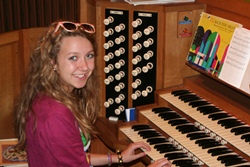 Organ Scholar Catherine Olver at the organ in St Bartholomew's Church when she was just 14.