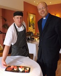 Pastry Chef Peter McVeigh, who will judge the big Bake off at the All Saints' Fete, with the rector the Rev Roger Thompson.