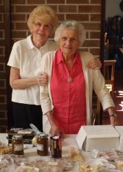 Phyllis Hunter and Sally Rankin at the cake stall.