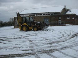 Richard gets to work clearing the carpark.