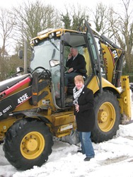 Yvonne and Richard Belshaw arrive at Magheragall in their digger on Palm Sunday.