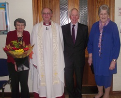 Canon George Irwin and his wife Deirdre received presentations from Kaye Somerville and Hilary Morrison to mark thei 25 years in Ballymacash parish.