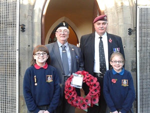 Emily and Katie Conn were on the Wreath Laying Party at the Service of Remembrance in Carnmoney. They are pictured with two former servicemen.