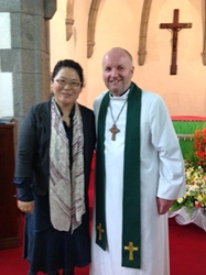 Bishop Alan with his interpreter Paula at Busan Cathedral.