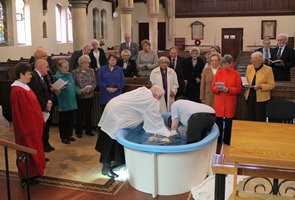 Wellington is baptised during the service in St Nicholas, Belfast, on Easter Sunday.