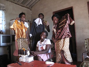 Finding a way out of poverty - the joyous 'Busy Girls' in their dressmaking enterprise.