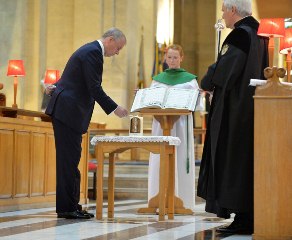 HRH The Duke of York lights a candle of remembrance.