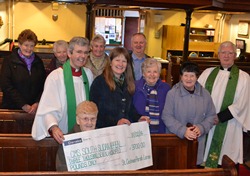 Mrs Martha Adamson (seated) with members of the Wednesday morning congregation with the St Cedma's cheque for £3,700 which was presented to Mrs Jenny Smyth of CMSI.