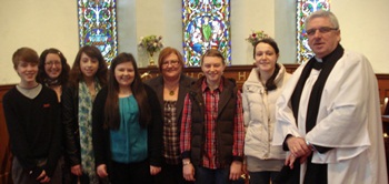 Members of the Youth Fellowship group, Parish of Ramoan, with their leader Mrs Shona Bell (second from left) and Mrs Joanne McFarlane, representative of  Kids 4 School(fifth from the left), and the rector the Rev David Ferguson.
