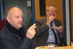 Bisho;p Alan and Dr Frank Dobbs enjoy a Sudanese meal during the prayer and share eveing at CMSI. No cutlery allowed.