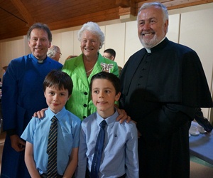 Pictured in St Peter's Cathedral at the Service of Vespers to say farewell to Dame Mary Peters who will soon complete her term of office at Lord Lieutenant for Belfast are, back from left: Dean John Mann, Dame Mary Peters, Father Hugh Kennedy and in front are St Peter's choirboys Thomas Lloyd and Daniel Quinn.