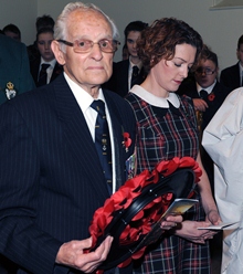 D-Day veteran Tommy Jess and his granddaughter Laura Brown (nee Graham) pictured laying a wreath at the 2013 Remembrance Day Service in Christ Church Parish.