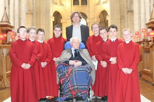 Billy Noble with Cathedral Master of the Choristers David Stevens, his assistant Therese Woodfield and some of the choristers.