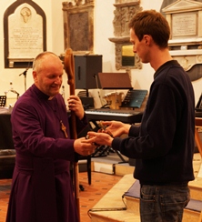 The Bishop of Connor, the Rt Rev Alan Abernethy, gets to meet the snake when pays a visit to St Patrick's on March 13.