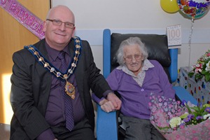 Alderman Billy Ashe, Mayor of Carrickfergus, helps Laura Clark celebrate her 100th birthday. Photograph courtesy of Phillip Byrne Photography, Larne