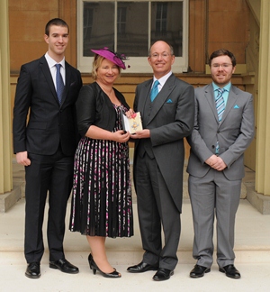 Professor Patrick Morrison and his family at Buckingham Palace where he received his CBE from The Princess Royal.