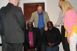 Prayering for Bishop Anthony and Rev Basil at the meeting in Ballymoney.