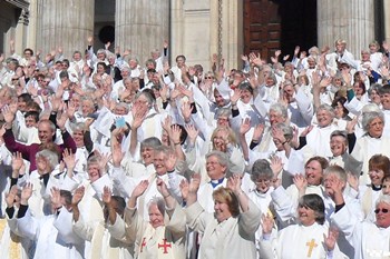 Mercia, on the right of the photo, approximately four rows from the front, joins other women priests and the Archbishop of Canterbury on the steps of St Paul's.