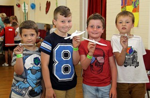 Boys at the Activity Week show off their crafts.