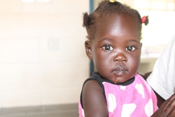 A little girl at the Martha Primary Care Clinic in Yei which was visited by members of the Connor META in January. The team received a grant from the Mission Support Fund in 2012.