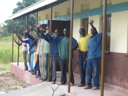 Local dignitaries celebrate the completion of one of the Mongo classroom blocks. They include members of the village committee responsible for building the school.