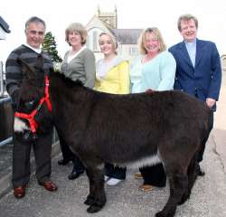 Pictured with the donkey at Magheragall Parish on Palm Sunday are John, Gill and Laura Roberts, Rae Seaton and the Rector, the Rev Nicholas Dark.