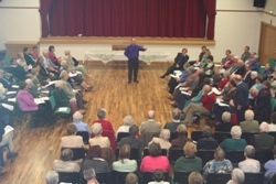 The crowd listens to Bishop Alan talk during the final Bushmills seminar.