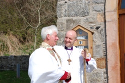 The sun shines on Bishop Alan and Archdeacon Jack Patterson outside St Thomas's Church.