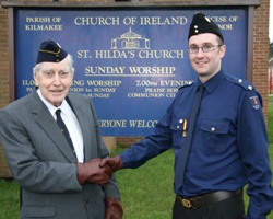 92-year-old Major Edgar McIlroy, the founder and first captain of St Hilda’s Church Lads’ Brigade and Church Girls’ Brigade, is congratulated on 50 years service by his grandson Martin Gillespie.