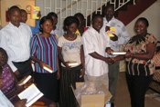 Teachers receive the bibles funded by Holy Trinity Woodburn.