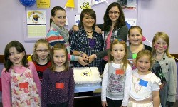 1st Derriaghy Guides, Brownies and Rainbows pictured at a special party in Christ Church, Derriaghy as they cut a cake celebrating 100 years of Guiding.