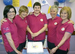 1st Derriaghy Guide, Brownie and Rainbow leaders pictured at a special party in Christ Church, Derriaghy as they cut a cake celebrating 100 years of Guiding.  L to R: Julie Aiken, Carla Budd, Barbara Morrison, Rosemary Fell and Alexis Burrows.