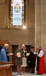 Bishop Alan (right) dedicates the memorial window in St Anne's Cathedral.