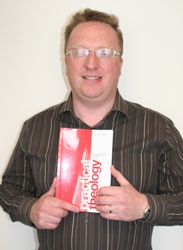 Training co-ordinator Peter Hamill with the issue of the Journal of Practical Theology in which is work is published.